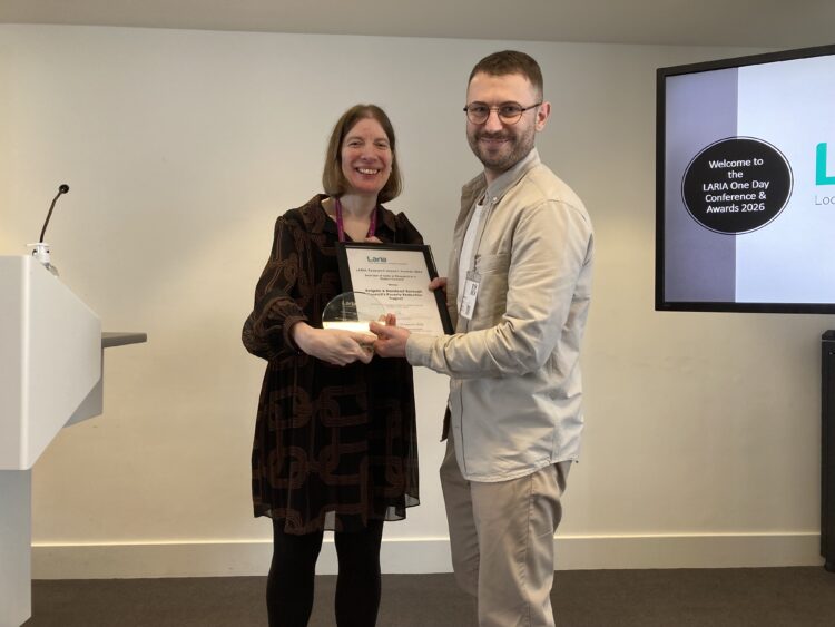 Juliet Whitworth, Head of Research and Information, Local Government Association and LARIA Council Member, presents the LARIA award 2026 for Best use of data or research in a district council to Matt Sprange, Financial Resilience Officer, Reigate & Banstead Borough Council