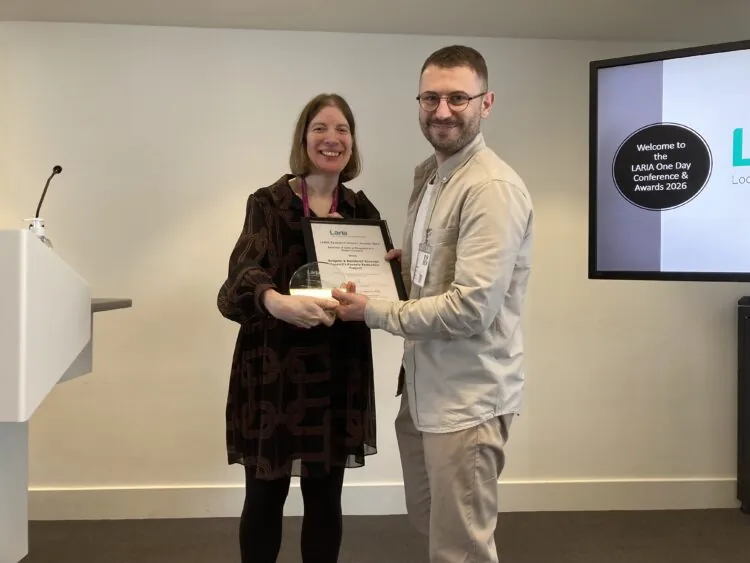 Juliet Whitworth, Head of Research and Information, Local Government Association and LARIA Council Member, presents the LARIA award 2026 for Best use of data or research in a district council to Matt Sprange, Financial Resilience Officer, Reigate & Banstead Borough Council