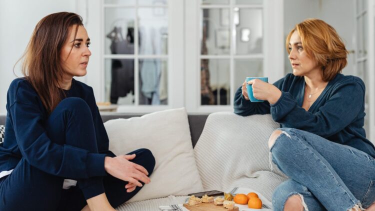 People sat on sofa discussing