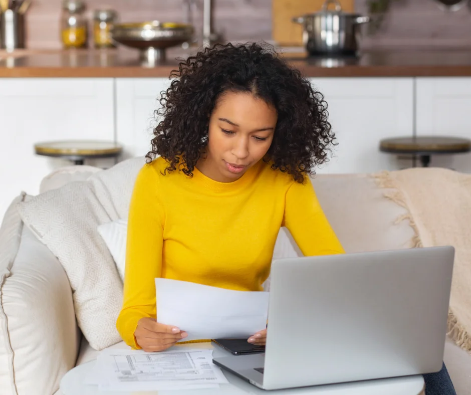 Woman looking at bills