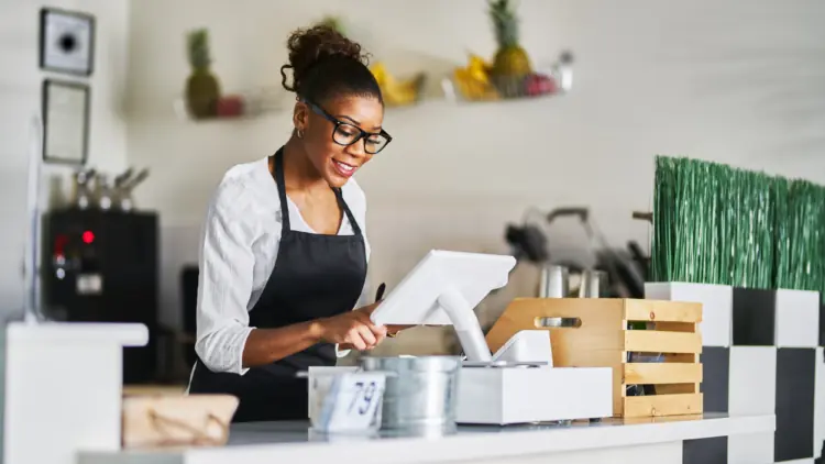 Lady working at till