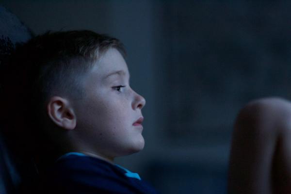Image of a sad boy to illustrate a blog post on what linking children’s social care and benefits data can tell us
